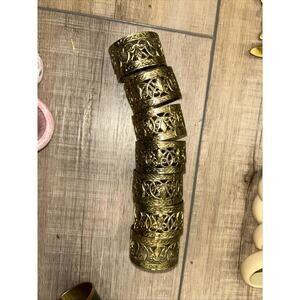 7 vintage metal napkin rings gold tone